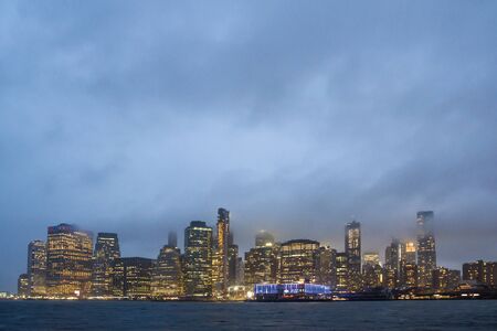 Beautiful view of New York city skyline with waterfront at twilight, USAの写真素材
