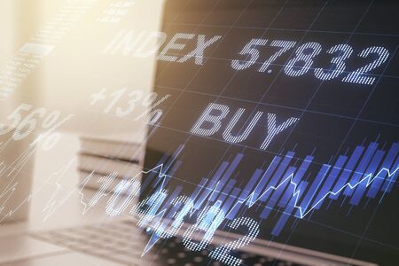 Abstract creative financial graph on modern laptop background, financial and trading concept. Multiexposureの写真素材