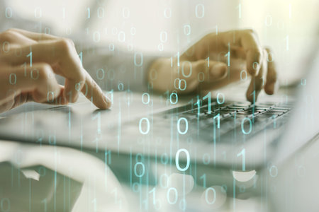 Creative abstract binary code hologram and hands typing on computer keyboard on background, AI and...
