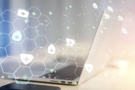 Creative concept of abstract medical illustration on modern laptop background. Medicine and healthcare concept. Multiexposureの写真素材