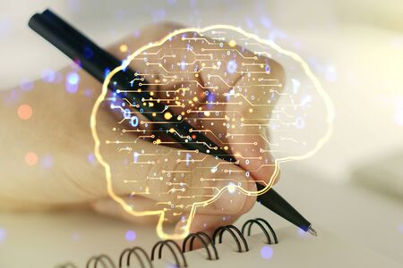 Double exposure of creative human brain microcircuit with man hand writing in notepad on background. Future technology and AI conceptの写真素材