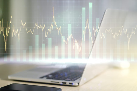 Double exposure of abstract creative financial diagram on modern laptop background, banking and...