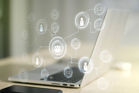 Social network concept with modern laptop on background. Multiexposureの写真素材