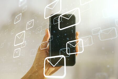 Creative abstract postal envelopes sketch and hand with cellphone on background, e-mail and marketing concept. Double exposureの写真素材
