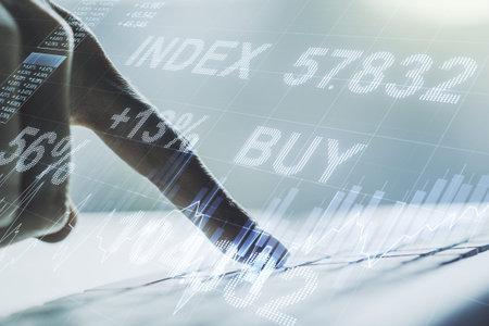Multi exposure of abstract creative financial chart with hand typing on computer keyboard on...