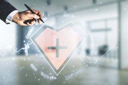 Double exposure of male hand with pen working with abstract virtual heart rate hologram on blurred interior background. Healthcare technolody conceptの写真素材