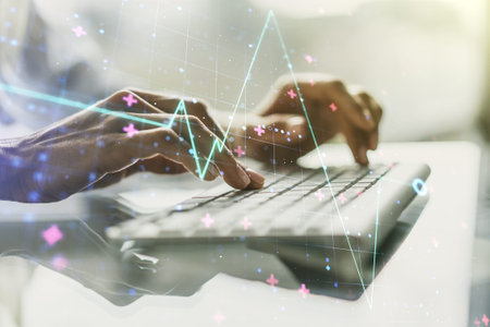 Double exposure of creative abstract heart rate hologram and hands typing on laptop on background....