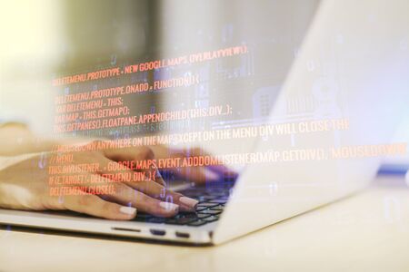 Abstract creative coding concept with hands typing on laptop on background. Multiexposureの写真素材