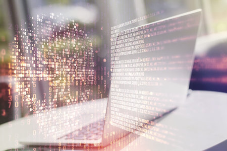 Double exposure of creative code skull hologram on laptop background. Malware and cyber crime...