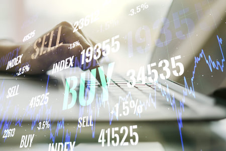 Abstract creative financial graph with hand typing on laptop on background, financial and trading...