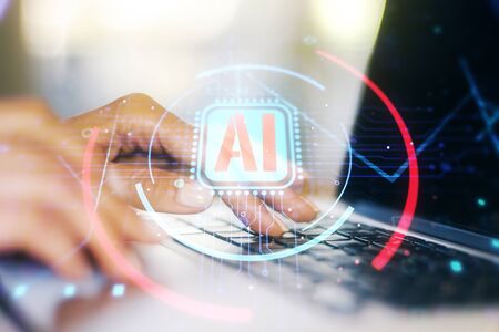 Double exposure of creative artificial Intelligence abbreviation with hand typing on computer keyboard on background. Future technology and AI conceptの写真素材