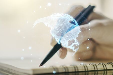 Double exposure of graphic America map and woman hand writing in notepad on background, big data and digital technology conceptの写真素材