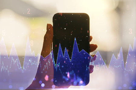 Multi exposure of abstract statistics data hologram interface and hand with cellphone on background,...