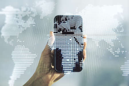 Double exposure of abstract digital world map and hand with cellphone on background, big data and blockchain conceptの写真素材