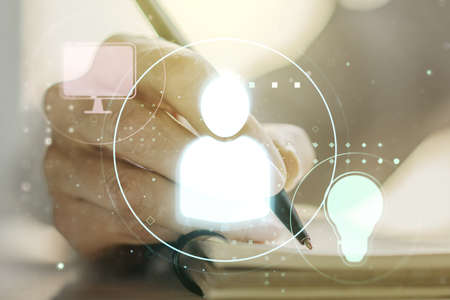 Social network media concept with woman hand writing in diary on background. Double exposureの写真素材