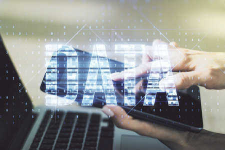 Creative Data word hologram and finger clicks on a digital tablet on background, big data and blockchain concept. Multiexposureの写真素材