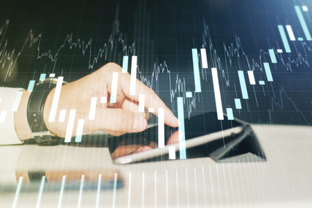 Multi exposure of abstract financial graph and hand working with a digital tablet on background,...