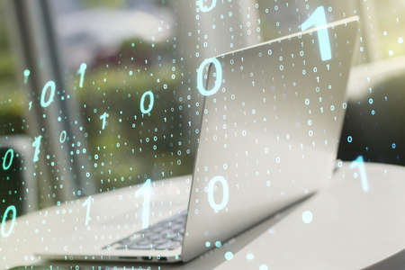 Creative abstract binary code sketch on modern laptop background, hacking and matrix concept. Multiexposureの写真素材