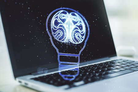 Creative light bulb with human brain hologram on modern laptop background, artificial Intelligence and neural networks concept. Multiexposureの写真素材