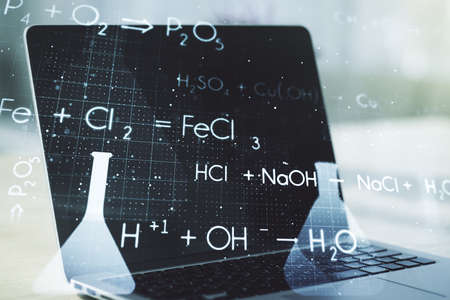 Double exposure of creative chemistry concept on laptop background, research and development conceptの写真素材