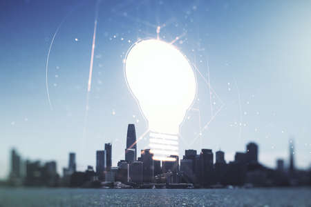 Double exposure of creative light bulb hologram on San Francisco city skyscrapers background, research and development conceptの写真素材