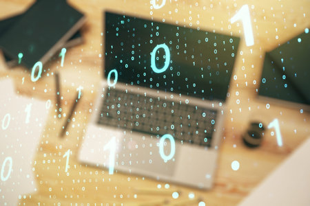 Creative concept of binary code illustration on modern laptop background. Big data and coding...