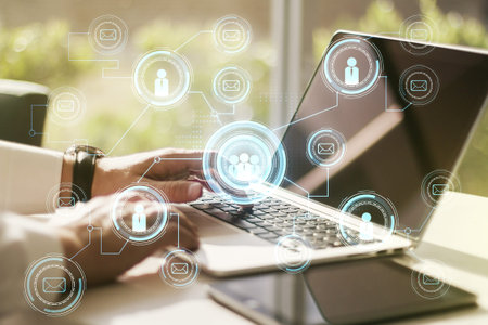 Double exposure of social network icons concept with hand typing on computer keyboard on background....