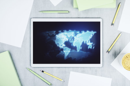 Modern digital tablet display with abstract creative world map, research and analytics concept. Top...