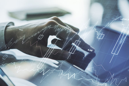 Double exposure of abstract creative financial chart with finger clicks on a digital tablet on...