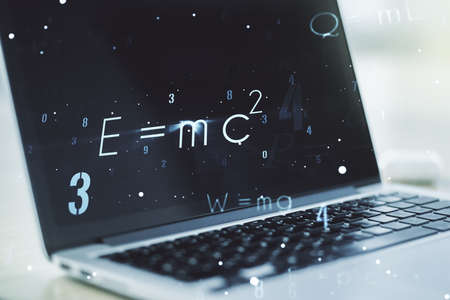 Creative scientific formula concept on modern laptop background. Multiexposureの写真素材