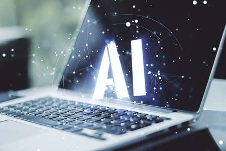 Creative artificial Intelligence symbol concept with modern laptop on background. Multiexposureの写真素材