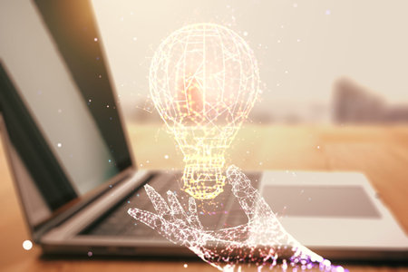 Double exposure of creative light bulb hologram on laptop background, research and development...