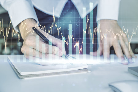 Multi exposure of abstract financial diagram with hand writing in notepad on background, banking and...