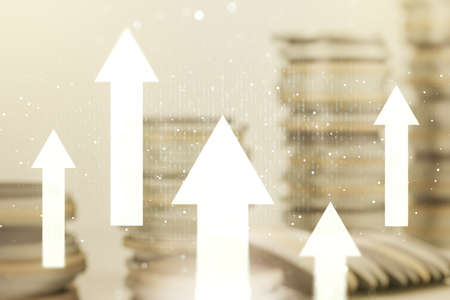Double exposure of abstract virtual upward arrows hologram on growing stacks of coins background. Ambition and challenge conceptの写真素材