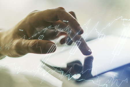 Abstract creative financial graph with finger clicks on a digital tablet on background, forex and...