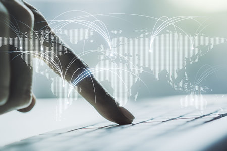 Double exposure of abstract digital world map with connections and hands typing on laptop on background, research and strategy conceptの写真素材