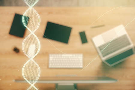 Creative DNA sketch on modern laptop background, biotechnology and genetic concept. Multiexposureの写真素材