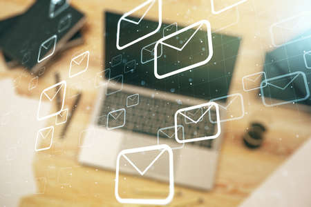 Double exposure of postal envelopes hologram on laptop background. Electronic mail and spam conceptの写真素材