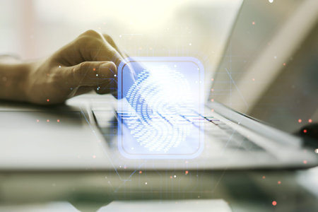 Abstract creative fingerprint concept with hands typing on laptop on background. Multiexposure