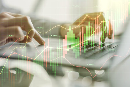 Multi exposure of abstract creative financial graph with hand typing on laptop on background, forex...