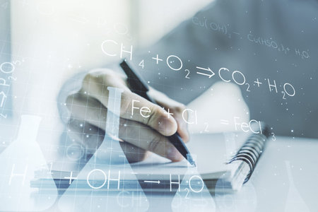 Creative chemistry concept with man hand writing in notebook on background. Multiexposure