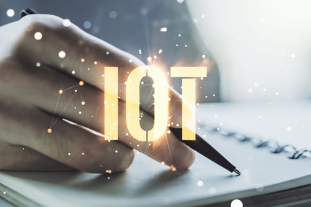 Double exposure of creative IOT hologram with man hand writing in notebook on background, research...