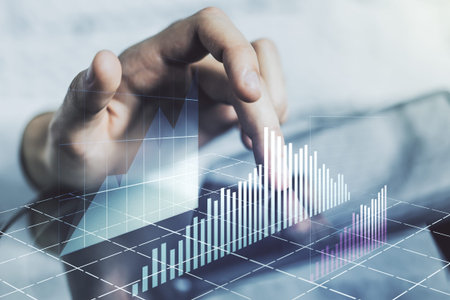 Multi exposure of abstract financial graph and hand working with a digital tablet on background,...