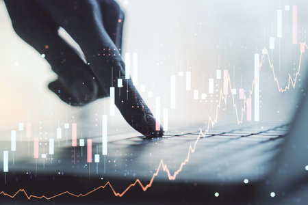Multi exposure of abstract financial graph with hand typing on laptop on background, financial and...