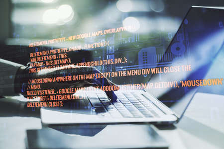 Double exposure of abstract creative programming illustration and hands typing on laptop on background, big data and blockchain conceptの写真素材