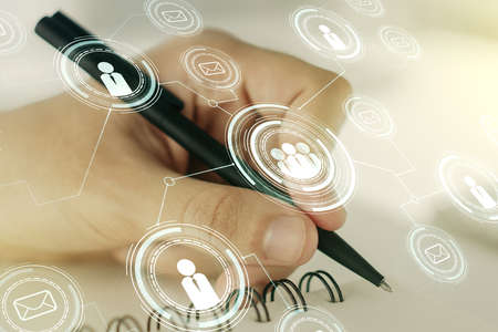 Social network concept with man hand writing in notebook on background. Multiexposureの写真素材