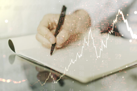 Double exposure of abstract creative financial diagram with world map and with man hand writing in...