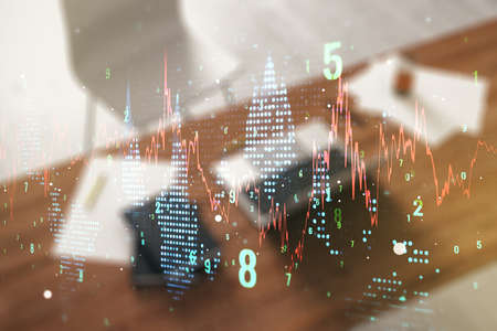 Abstract creative financial graph and modern desktop with computer on background, forex and investment concept. Multiexposureの写真素材