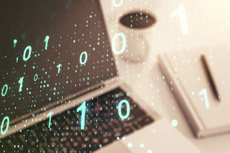 Creative abstract binary code sketch on modern laptop background, hacking and matrix concept. Multiexposureの写真素材