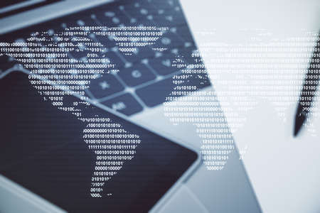 Abstract creative world map on modern laptop background, international trading concept. Multiexposureの写真素材